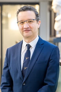 headshot of Mohamed rabie stood in a suit