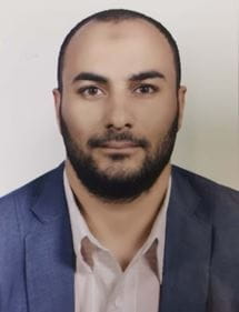 headshot of Mohamed Salman wearing a blue suit against a white background