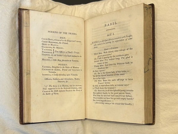 Open spread from a hardbound book, with pages headed 'Persons of the drama' and 'Basil act 1'